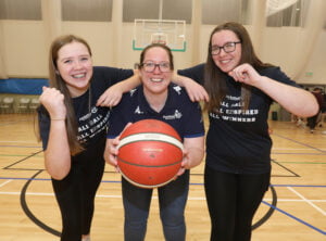 Smiles all round from new BNI secretary Sarah McCann and her daughters
